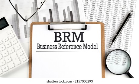 Paper with BRM - Business Reference Model on a table with charts