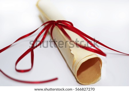 Paper bundle with red ribbon. Isolated on white background.