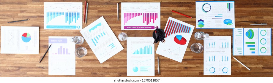 Paper With Business Chart On Wooden Office Table Closeup Background. Finansial Webinar Concept. Site Header Mockup