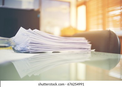 Paper Business Documents Of Unfinished Stacked On Office Desk Archive,in Archive Analyzing The Market And Considers On The Size Of Future Profits On Table Office.