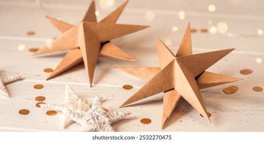 Paper Christmas stars on white wooden table. Front view. - Powered by Shutterstock