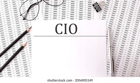 Paper With CIO- Chief Investment Officer On A Table On The Charts