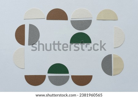 paper circles cut in half and arranged on blank paper