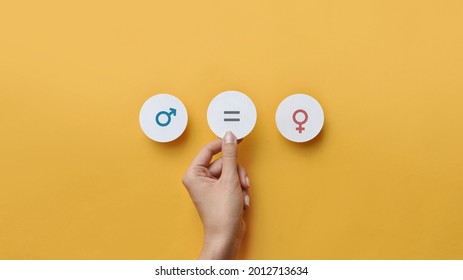 Paper circles with the icons men and women Equality between men and women. Gender equality and tolerance - Shutterstock ID 2012713634