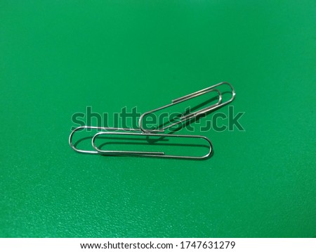 A paper clip or clip is a device for combining two or more sheets of paper based on the pressure principle. Paper clipped with clips can be easily removed again.