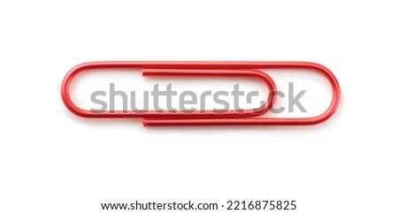 Paper clip. Metallic red paper clip isolated on white. Rotate image to change direction.
