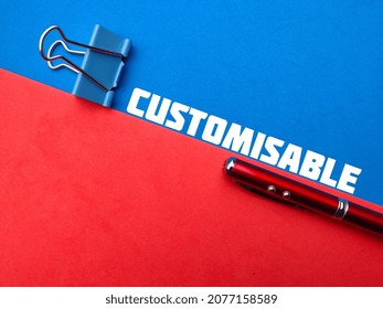 Paper clip and pen with word CUSTOMISABLE on red and blue background.