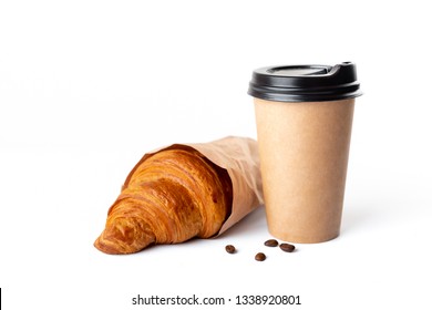 Paper coffee cup with croissant isolated on white background. Studio light. Food and drink photo. Good morning concept. - Shutterstock ID 1338920801