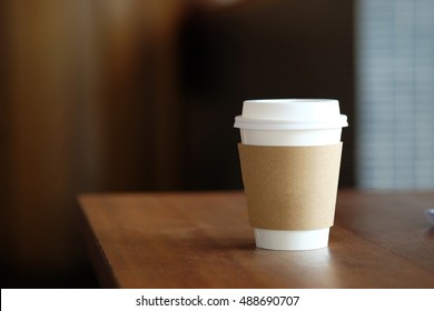 Paper Coffee Cup In Coffee Shop.