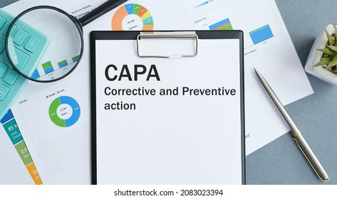 Paper with Corrective and Preventive CAPA action plans on a table