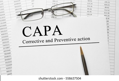 Paper with Corrective and Preventive CAPA action plans on a table