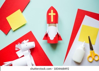paper craft for kids. DIY toy Saint Nicholas and white horse for sinterklaas day. create art for children. Netherlands Santa Claus