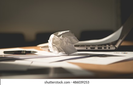 The paper was crumpled on the desk, it does not work out, a lot of stress and anxiety - Powered by Shutterstock