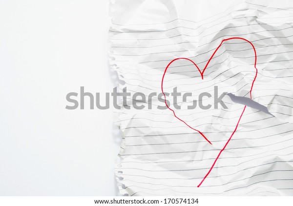 paper crushed with heart drawn on it on an\
isolated background