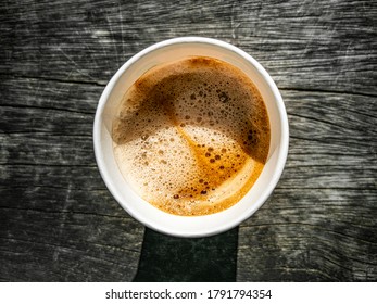 Paper Cup With Coffee To Go On Wooden Ground Texture From Above. Leherheide, Bremerhaven.