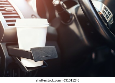 Paper Cup Of Coffee In Cup Holder In The Car