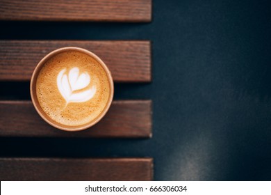 Paper Cup Of Coffee Take-away, Top View. Wooden Table And Place For Text.