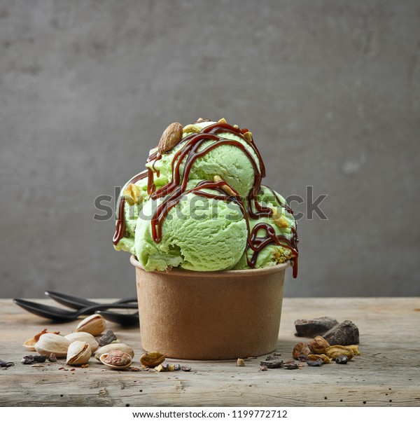 paper cup of pistachio ice\
cream