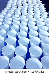 Paper Cups Filled With Water On Top Of A Table. Central Park, During Race.