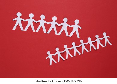 Paper Cut Chain Of People On Red Background