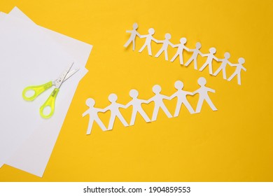 Paper Cut Chain Of People With Scissors On Yellow Background