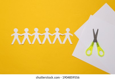 Paper Cut Chain Of People With Scissors On Yellow Background