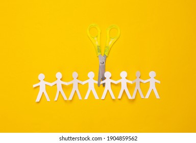 Paper Cut Chain Of People With Scissors On Yellow Background