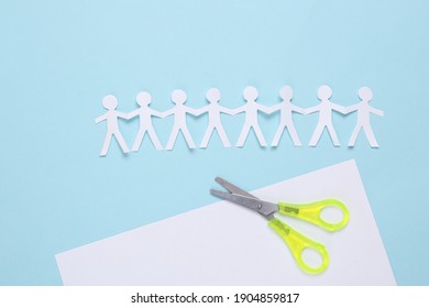 Paper Cut Chain Of People With Scissors On Blue Background