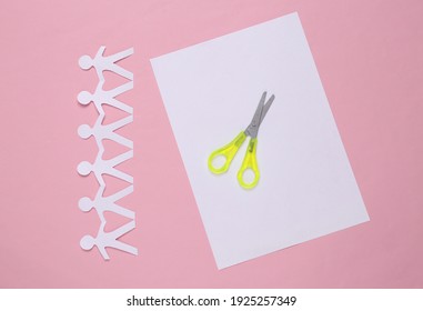 Paper Cut Chain Of People With Scissors On Pink Background