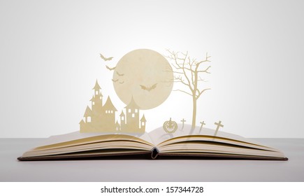 Paper Cut Of Halloween On Old Book