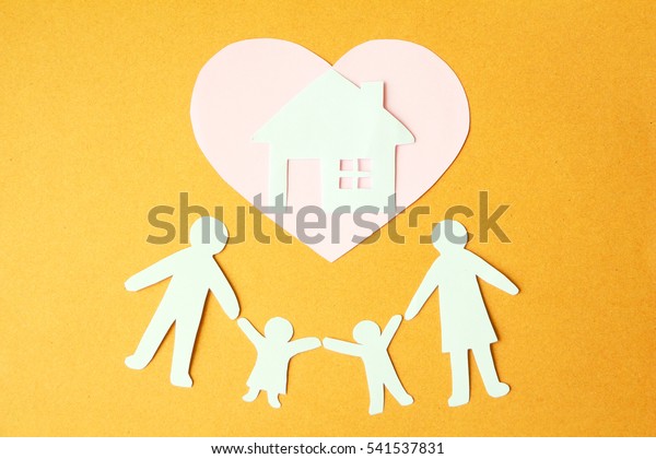 Paper cut of love family\
house.