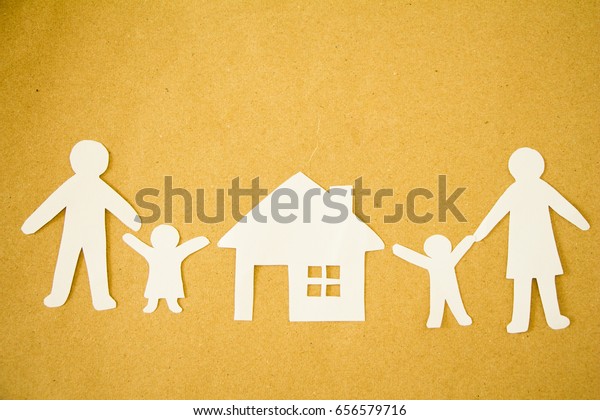 Paper cut of love family house on brown
background,family
concept.