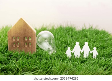 Paper cutout family, wooden house model and light bulb on green grass, sustainable and Eco-Friendly Family Lifestyle concept - Powered by Shutterstock