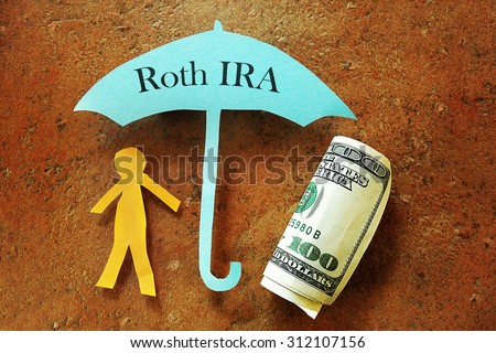Paper cutout person under a Roth IRA umbrella                               