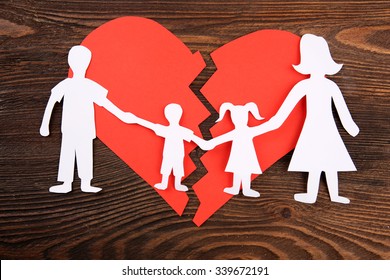 Paper Cutout Silhouette Of A Family Split Apart On A Paper Heart, Divorce Concept