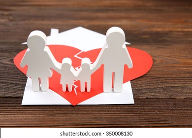 Paper Cutout Silhouette Of A Family Split Apart On A Paper Heart, Divorce Concept