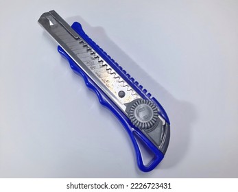 Paper cutter knife on white background