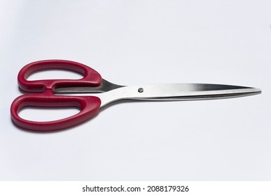 Paper cutting scissors on white background