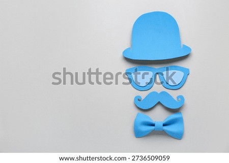Paper decor with hat, bow tie and moustaches for Father's Day on white background