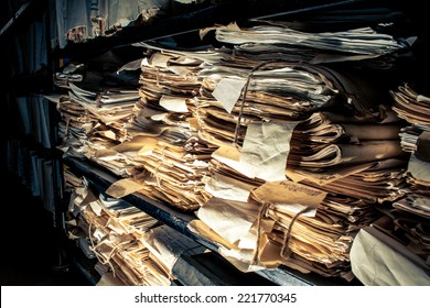 Paper Documents Stacked In Archive