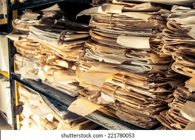 Paper Documents Stacked In Archive