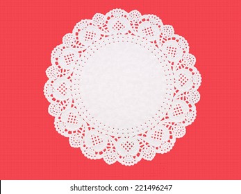 Paper doily on textured red. Celebration background.