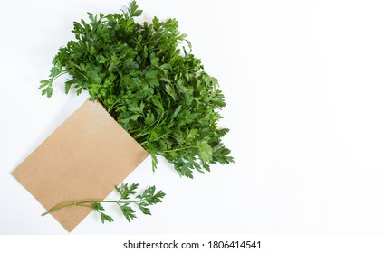 Paper Eco Bag With Fresh Parsley Isolated On White Background, Overhead View