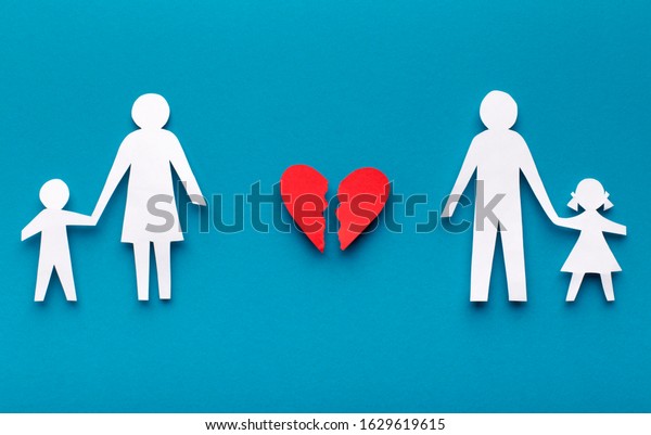 Paper family cut out chain and\
broken heart on blue background, divorce or family problems\
concept