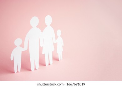 Paper Family Cut Out On Bright Pink Background, Family Home, Foster Care, Family Mental Health, Homeschool Education Concept. 