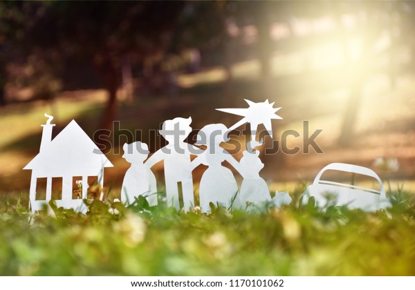 Paper family, house and car on a green grass. Family\
Life Insurance, protecting family, family  and love concepts.\
Concepts saving money for house or car. Mortgage and auto lending.\
Ecology concept. 