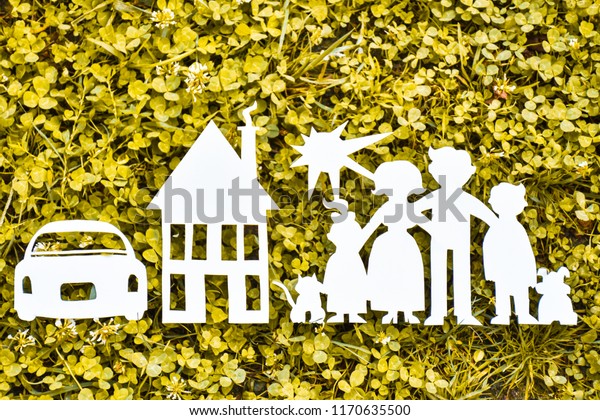Paper family, house and car on a green grass.\
Family Life Insurance, protecting family, family  and love\
concepts. Concepts saving money for house or car. Mortgage and auto\
lending. Ecology\
concept.\
