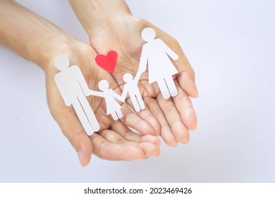 Paper family in the palm of your hand. Accident insurance concept, personal insurance that takes care of your loved ones. need protection Peace of mind in case of unexpected accidents.