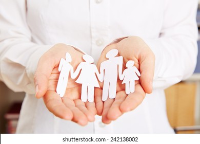 Paper Family Protected Safe In Two Female Hands