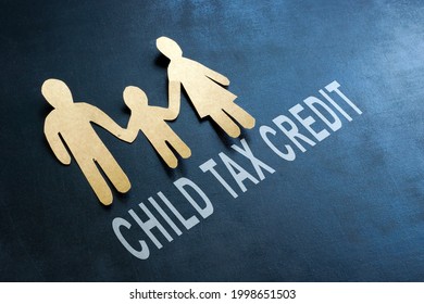 Paper Family And Words Child Tax Credit On The Blackboard.